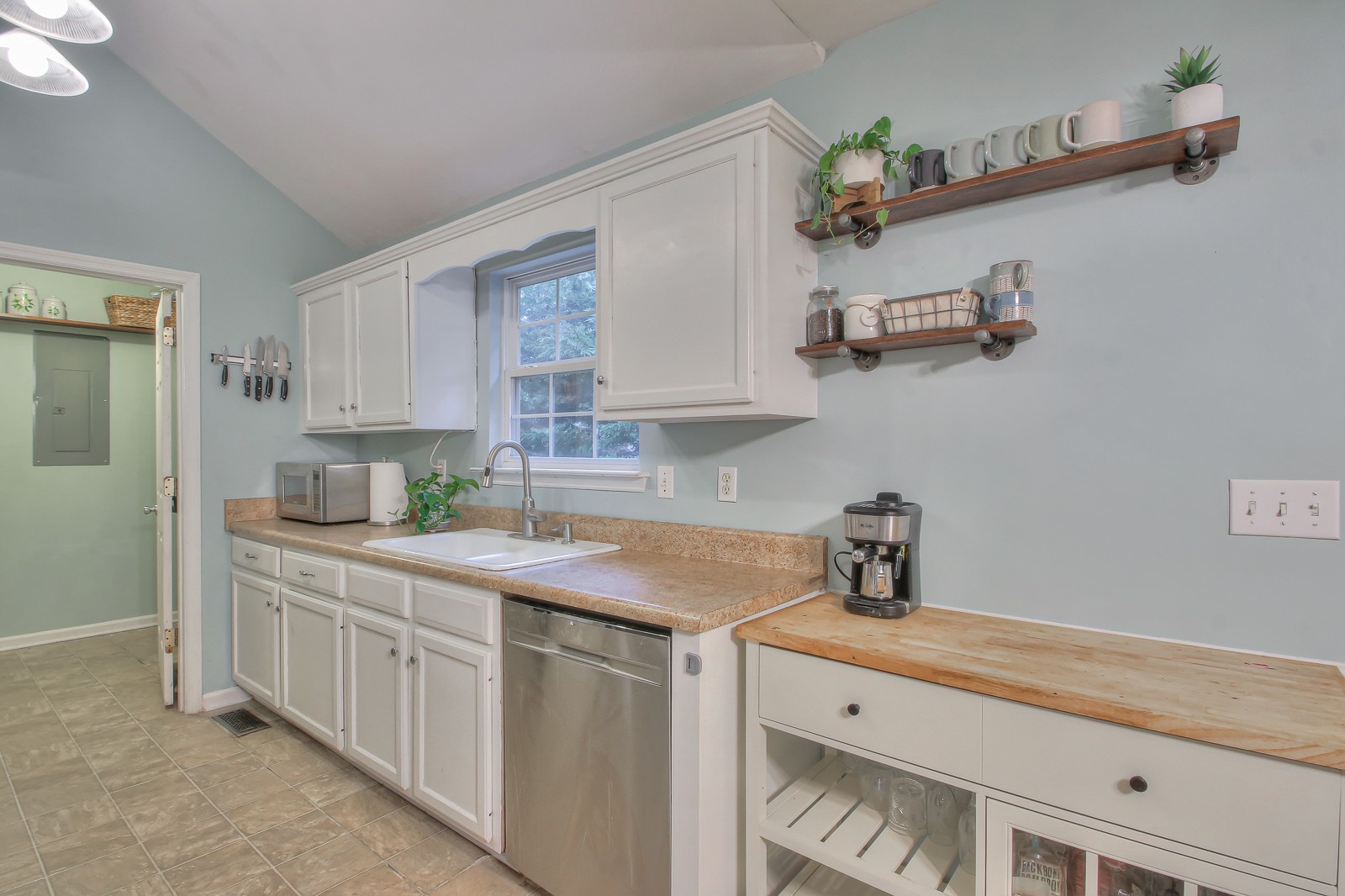 7481 Christopher Street Fairview, TN 37062 - Photo 33 of 42 a kitchen with a sink dishwasher and cabinets