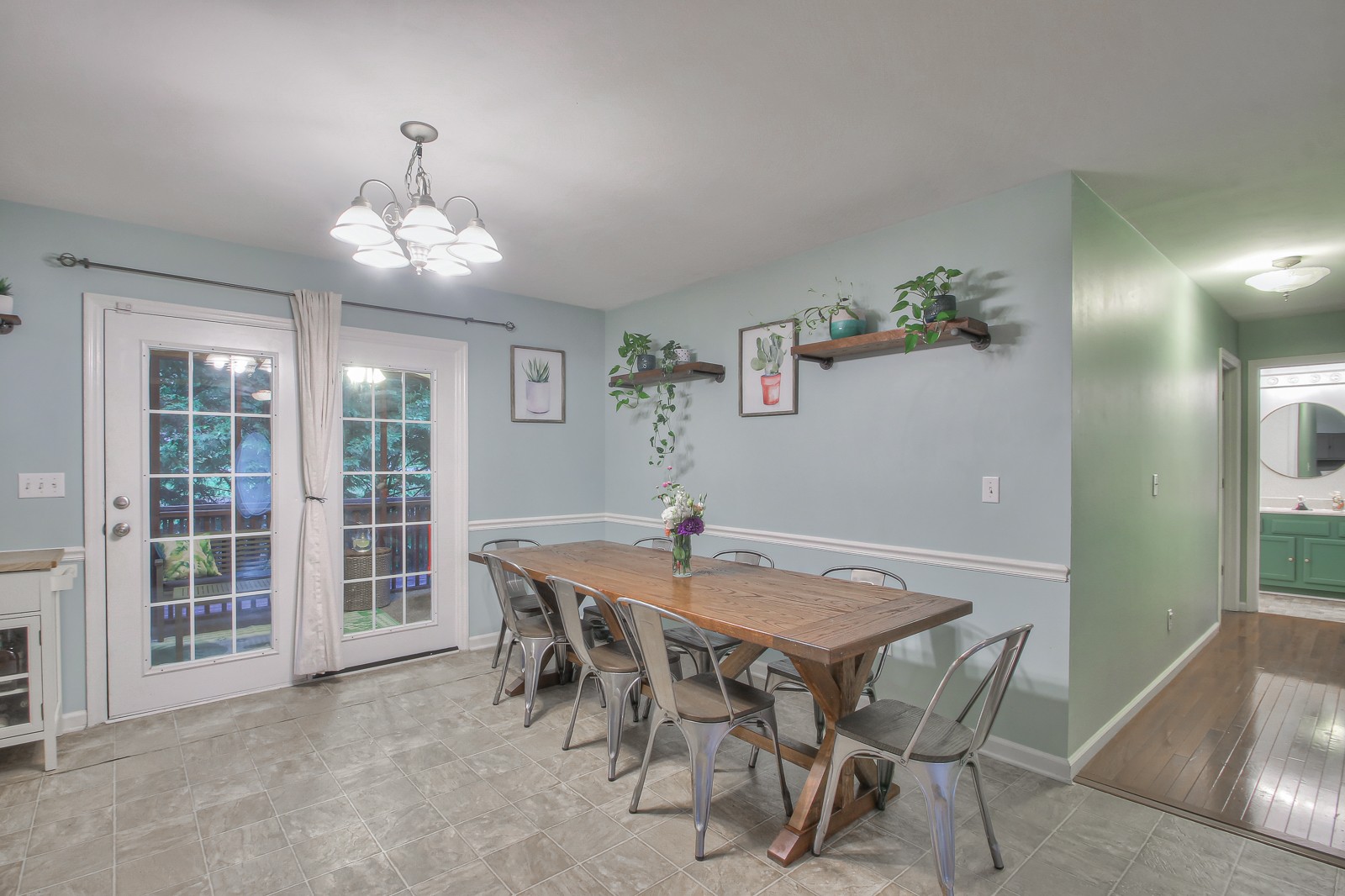7481 Christopher Street Fairview, TN 37062 - Photo 36 of 42 a view of a dining room with furniture and chandelier