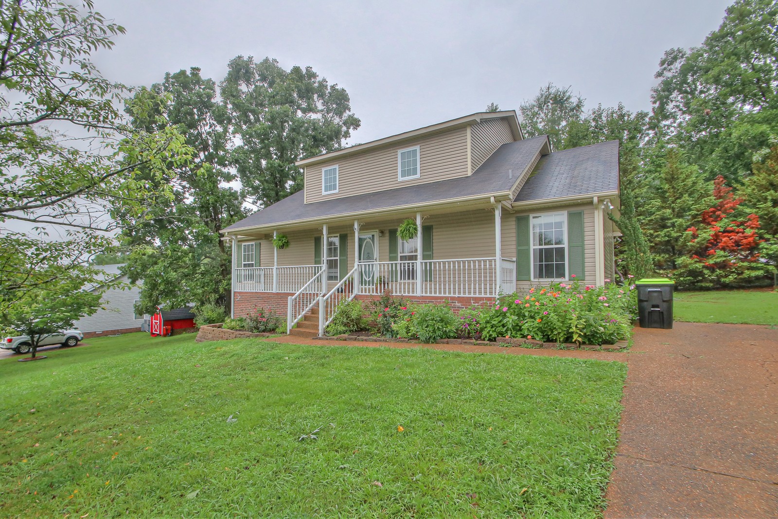 7481 Christopher Street Fairview, TN 37062 - Photo 4 of 42 a view of a house with a yard and plants