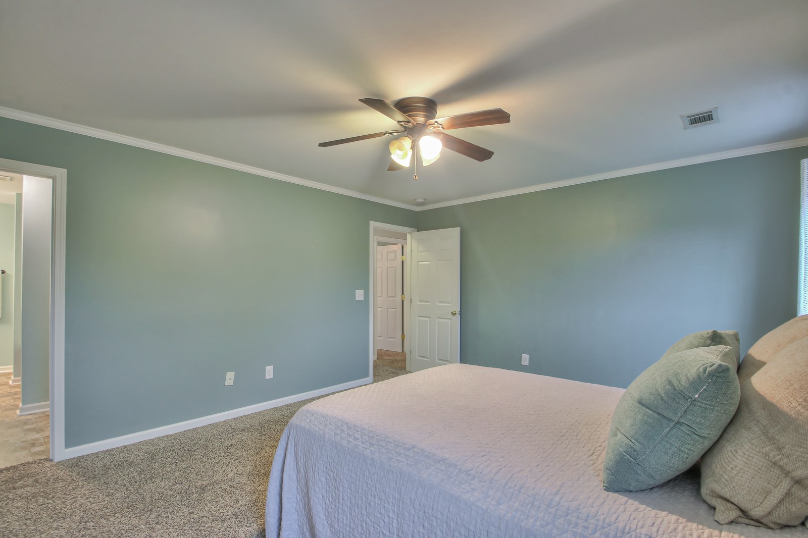 7481 Christopher Street Fairview, TN 37062 - Photo 9 of 42 a bedroom with a bed and a chandelier