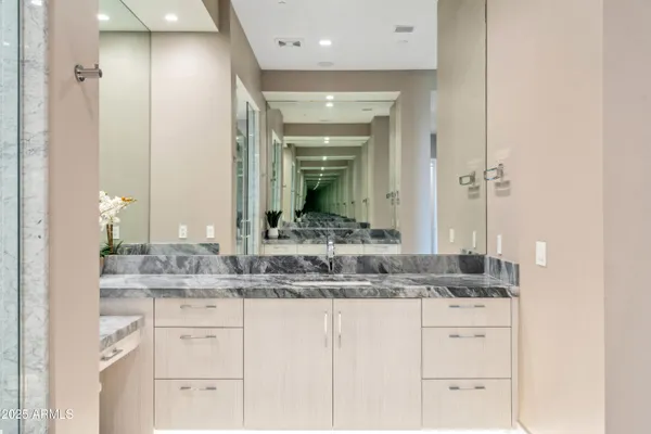 a bathroom with a sink and a mirror