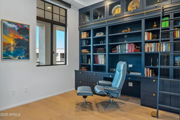 a view of a workspace with bookshelf