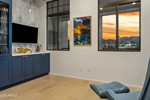 a room with furniture and a flat screen tv