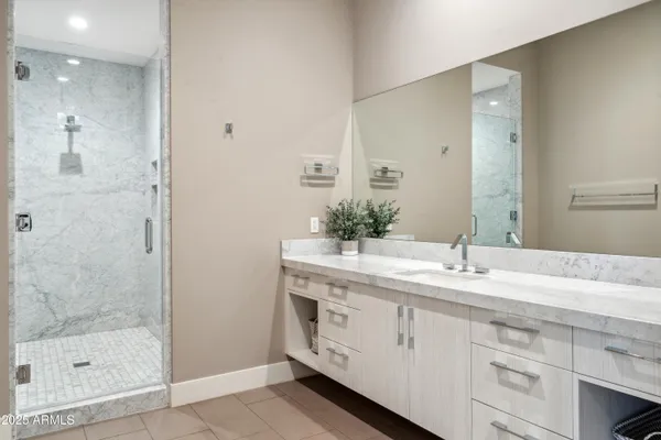 a bathroom with a sink and a mirror