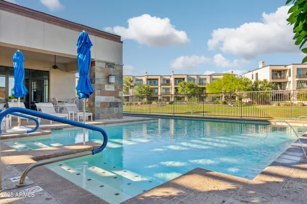 a view of a swimming pool with a patio