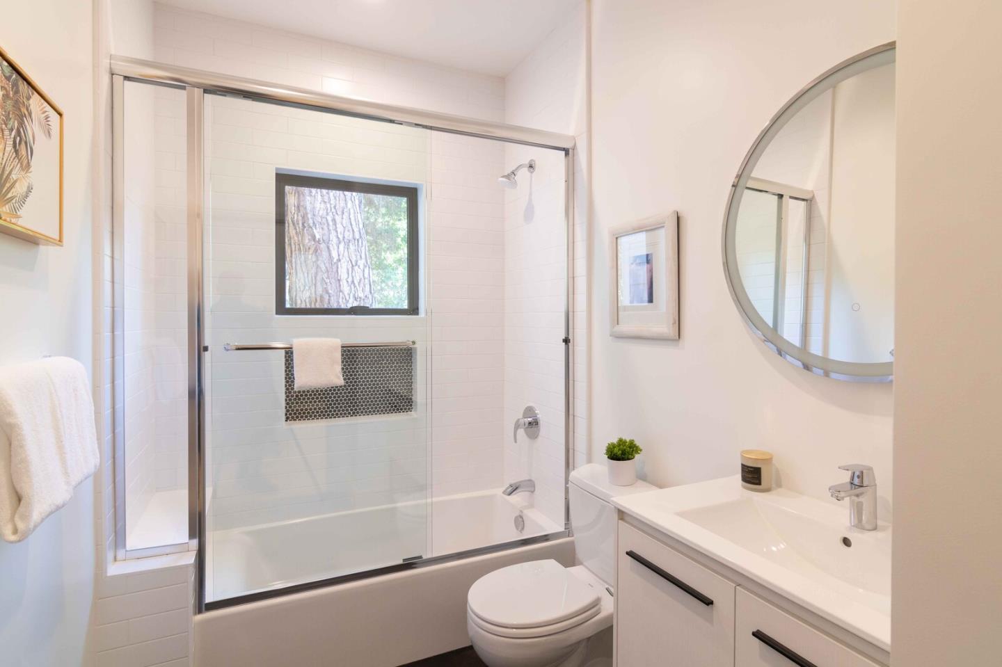 2465 Alpine Road Menlo Park, CA 94025 - Photo 14 of 28 a bathroom with a bathtub shower sink mirror and toilet
