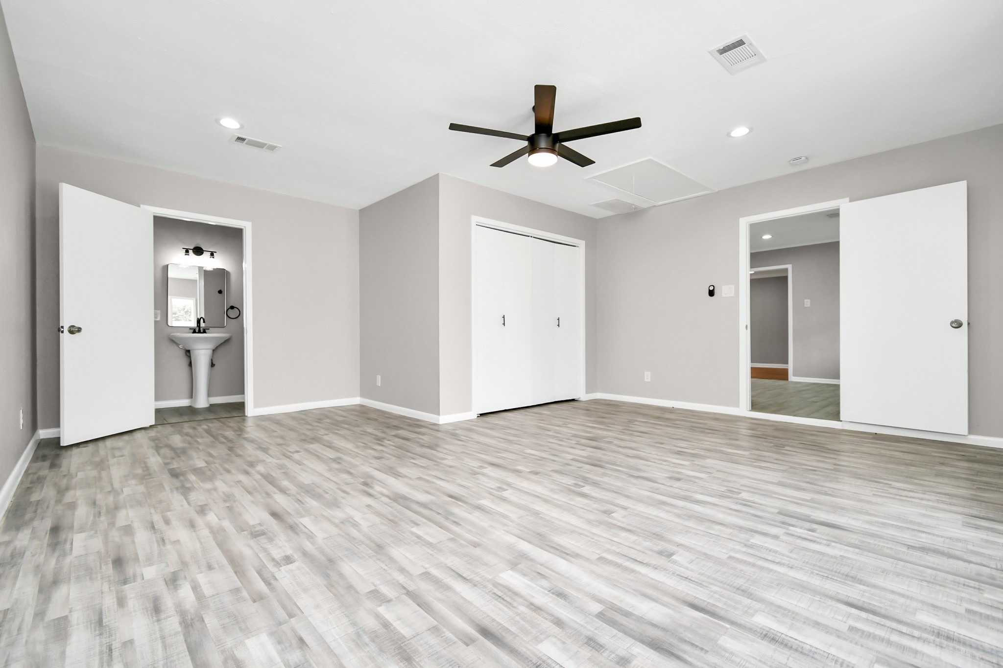 8034 Ridgeview Drive Houston, TX 77055 - Photo 13 of 44 a view of empty room with wooden floor and ceiling fan