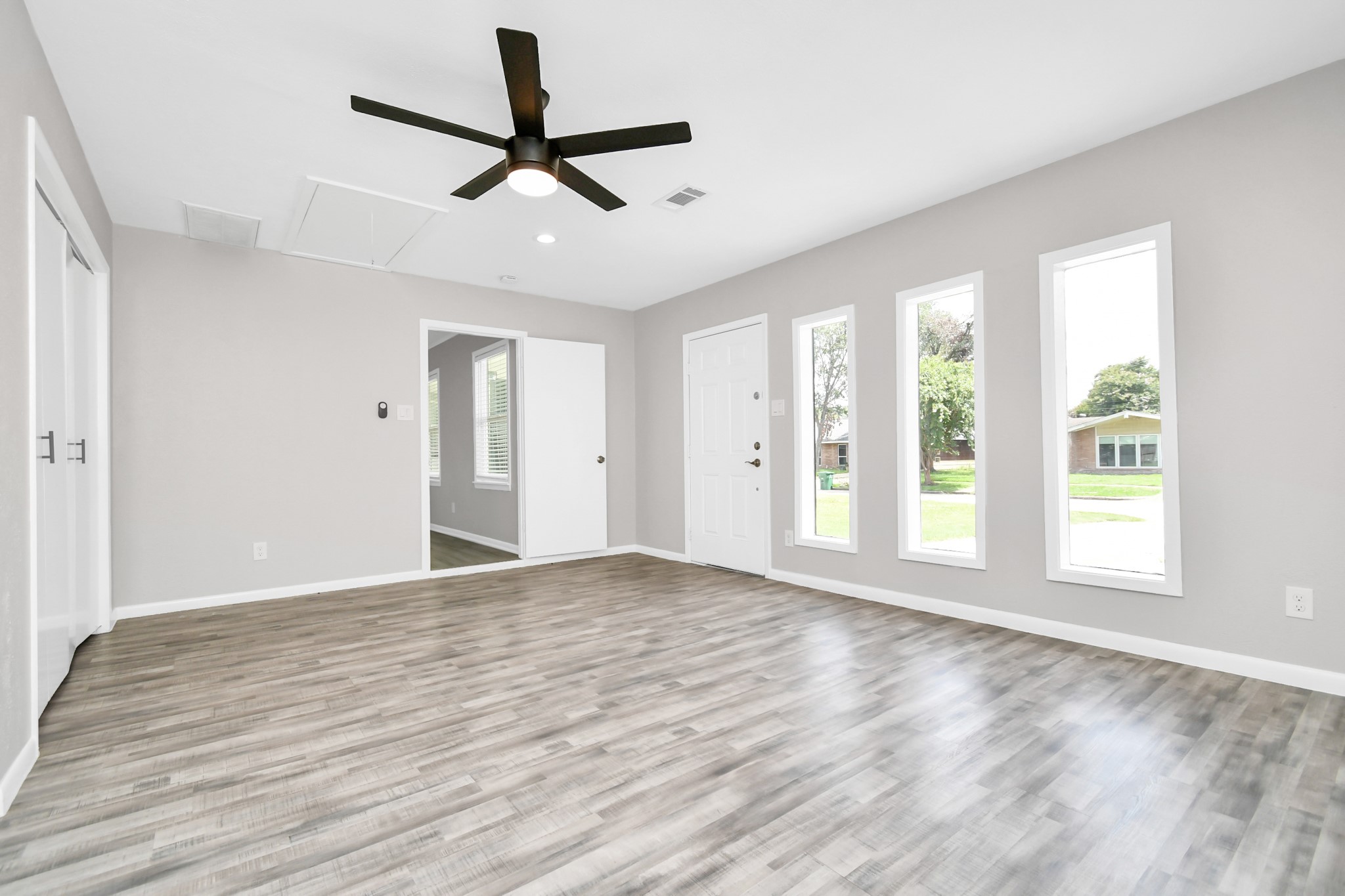 8034 Ridgeview Drive Houston, TX 77055 - Photo 14 of 44 a view of an empty room with a window and a ceiling fan
