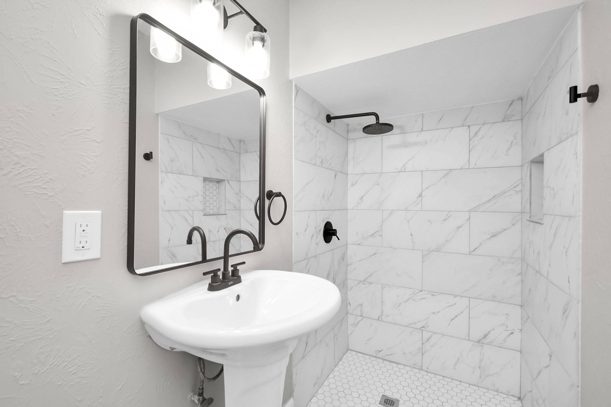 8034 Ridgeview Drive Houston, TX 77055 - Photo 15 of 44 a bathroom with a sink a mirror and shower