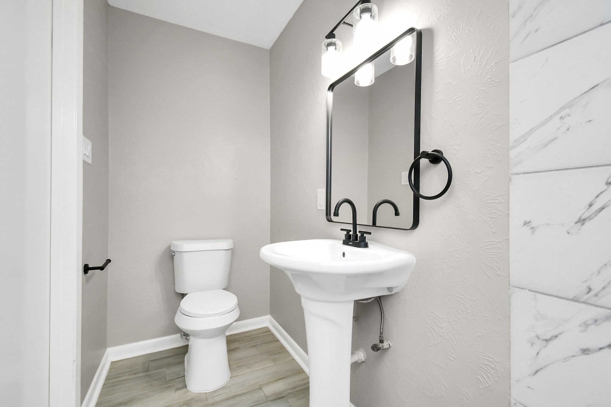 8034 Ridgeview Drive Houston, TX 77055 - Photo 16 of 44 a bathroom with a toilet sink and mirror