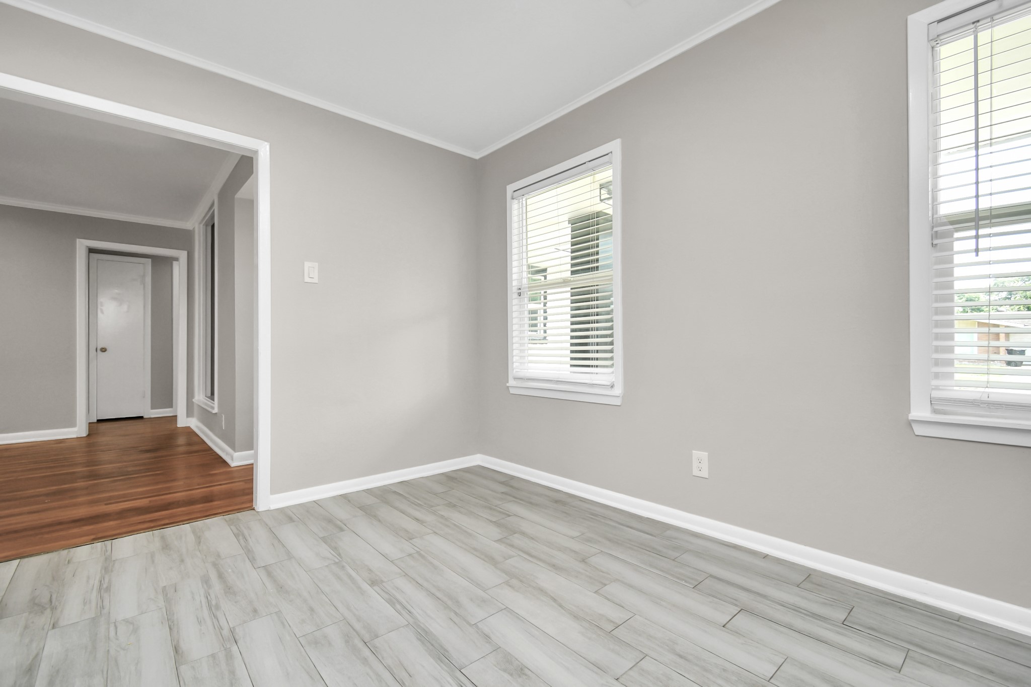 8034 Ridgeview Drive Houston, TX 77055 - Photo 17 of 44 a view of an empty room with wooden floor and a window