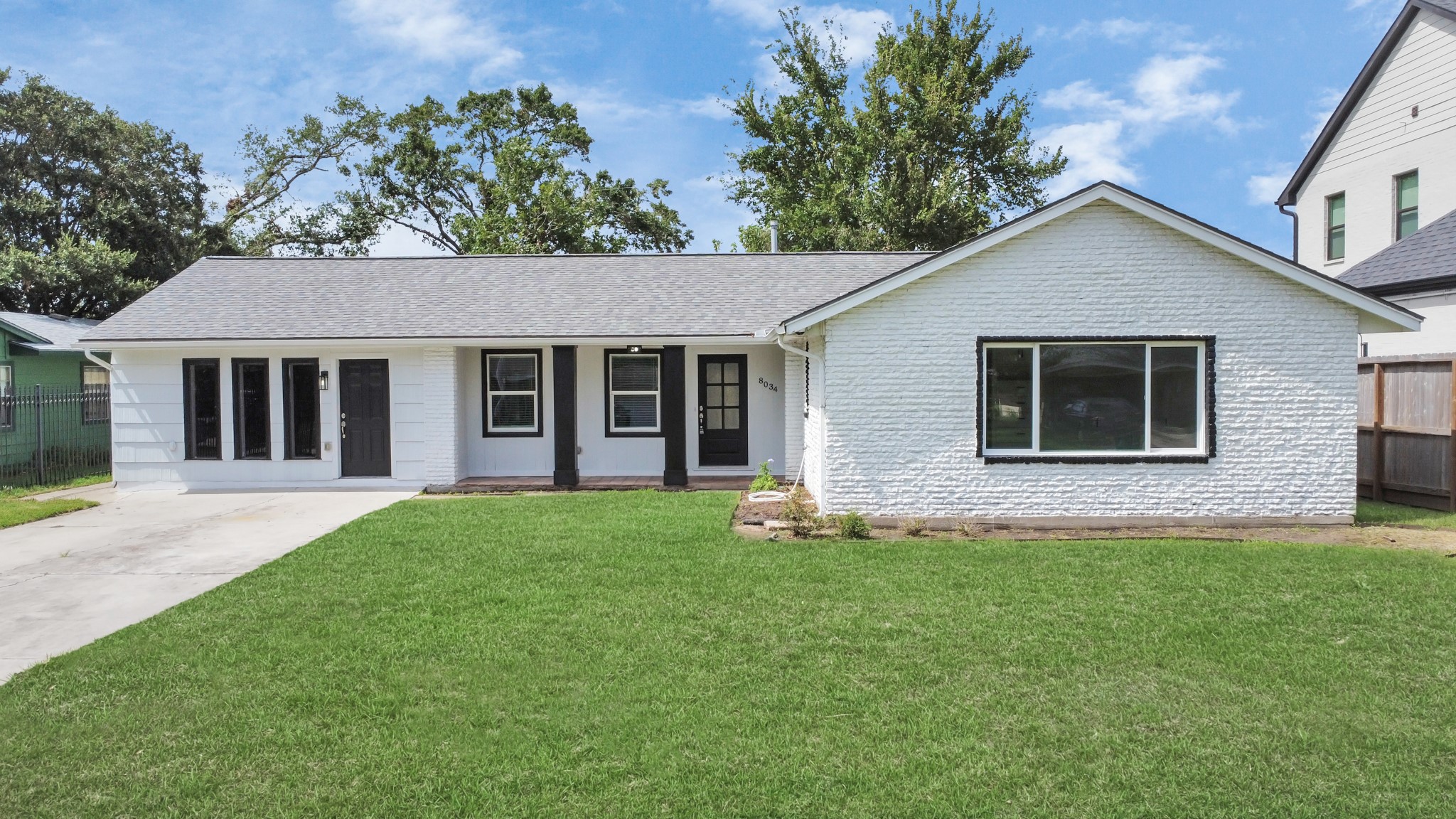 8034 Ridgeview Drive Houston, TX 77055 - Photo 2 of 44 front view of a house with a yard