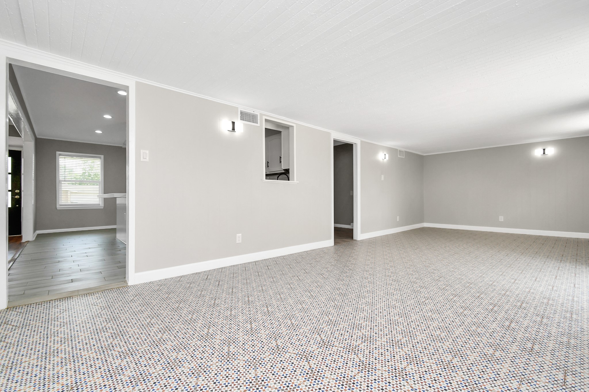 8034 Ridgeview Drive Houston, TX 77055 - Photo 22 of 44 a view of a hallway with wooden floor and a living room
