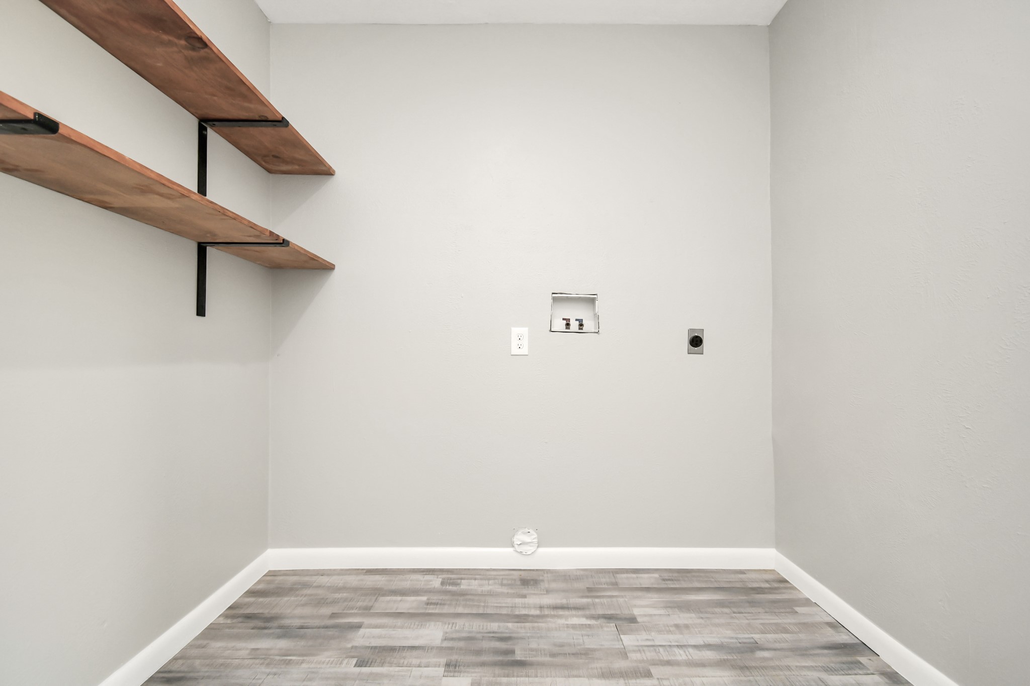 8034 Ridgeview Drive Houston, TX 77055 - Photo 24 of 44 a view of a room with racks on the wall