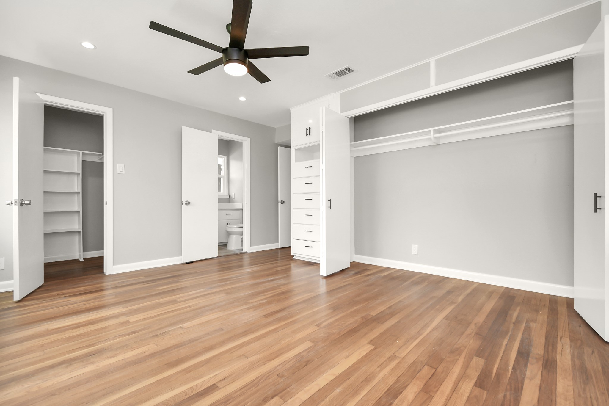 8034 Ridgeview Drive Houston, TX 77055 - Photo 26 of 44 wooden floor in an empty room with a window