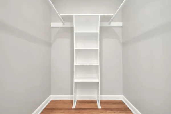 a view of a room with wooden floor