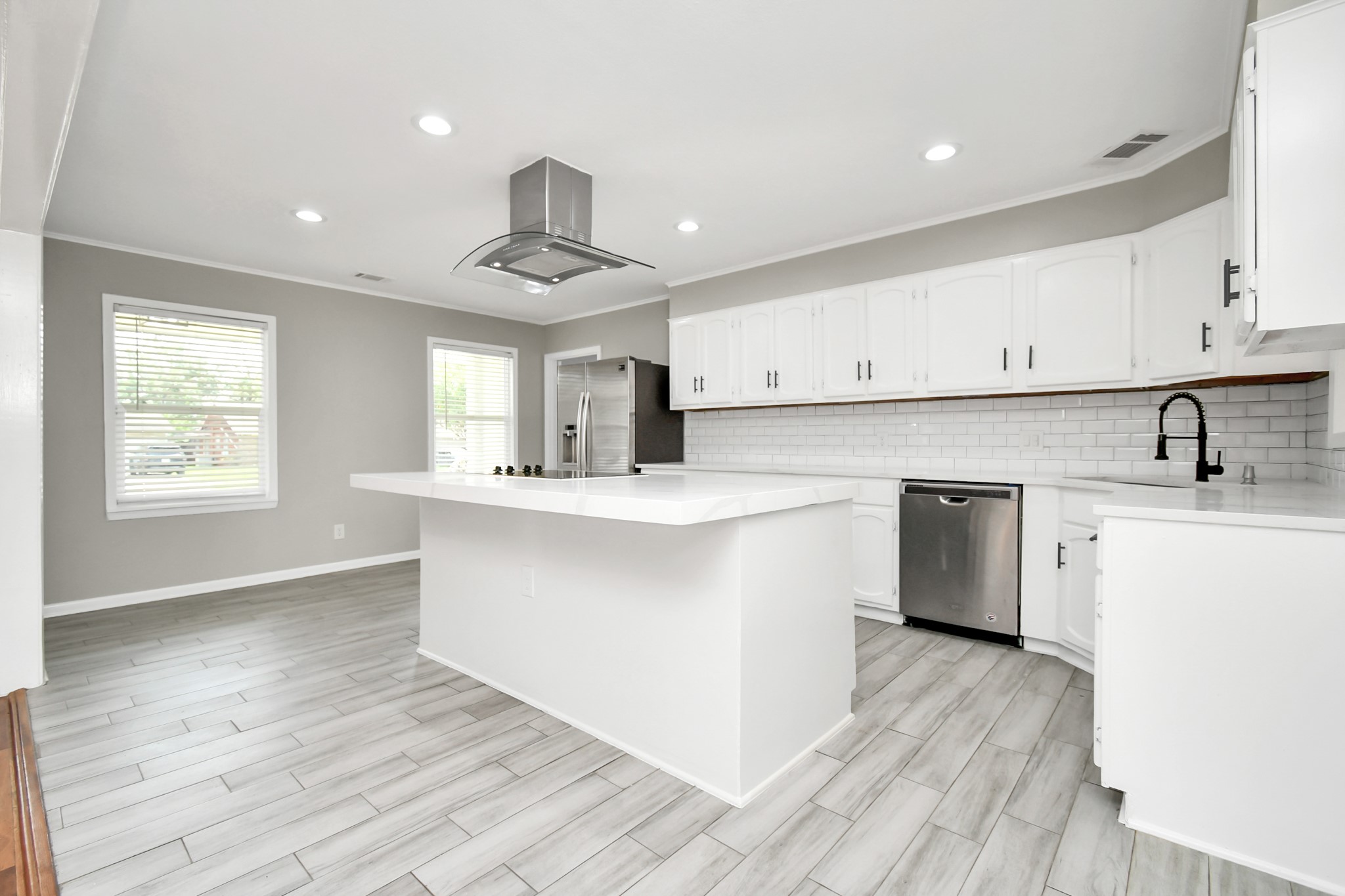 8034 Ridgeview Drive Houston, TX 77055 - Photo 3 of 44 a kitchen with stainless steel appliances a sink stove and cabinets