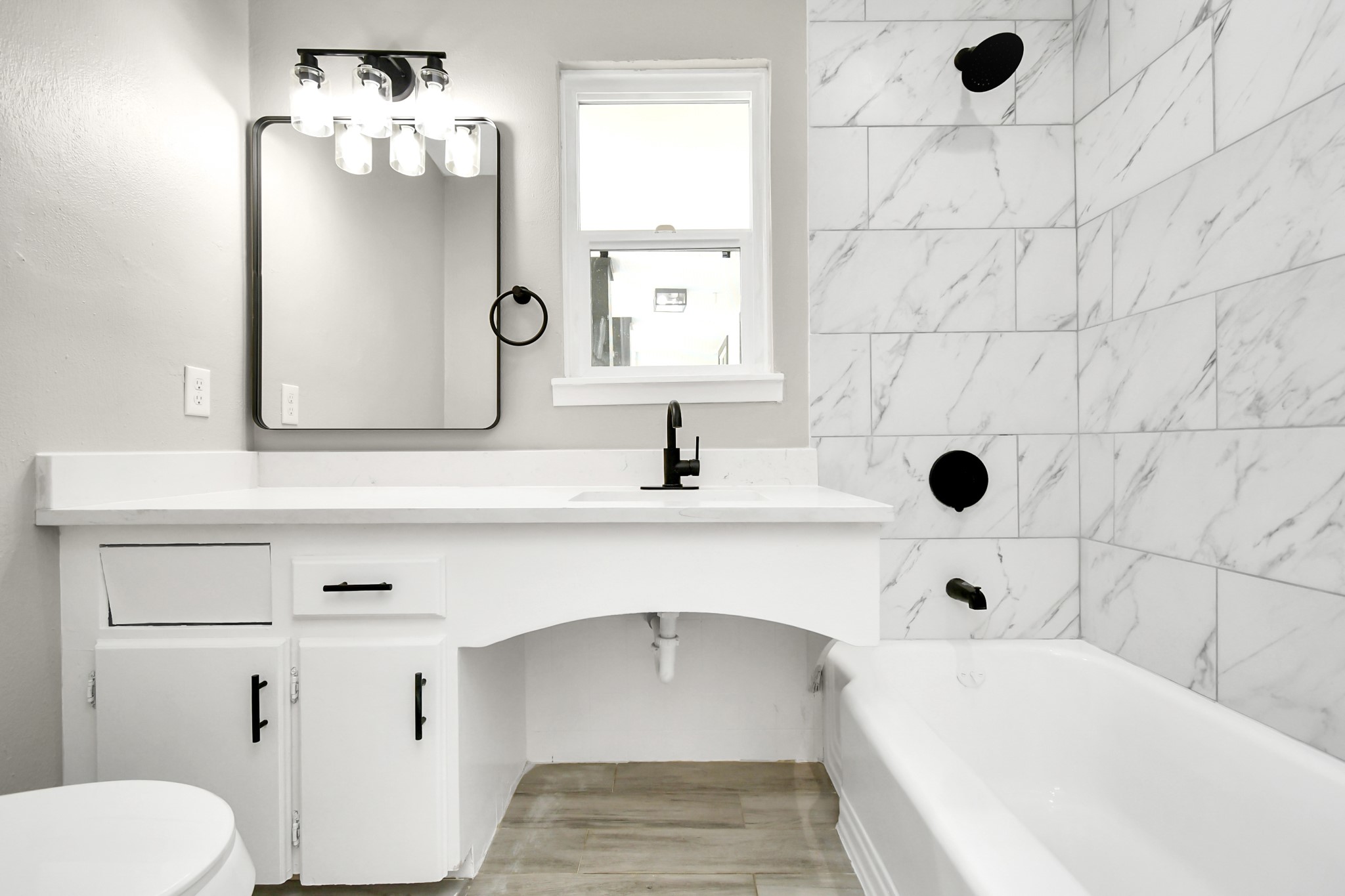 8034 Ridgeview Drive Houston, TX 77055 - Photo 34 of 44 a bathroom with a sink a toilet and shower