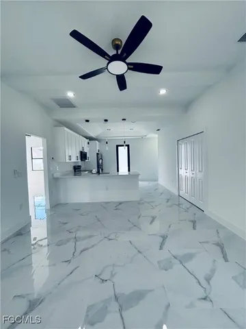 a kitchen with a refrigerator and a sink