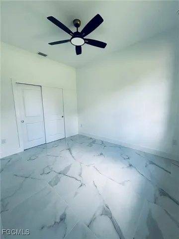 a view of empty room with windows