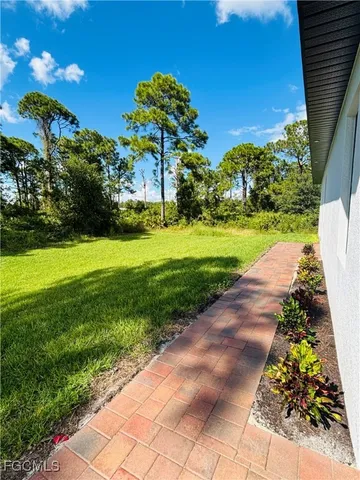 a view of a garden with a fountain