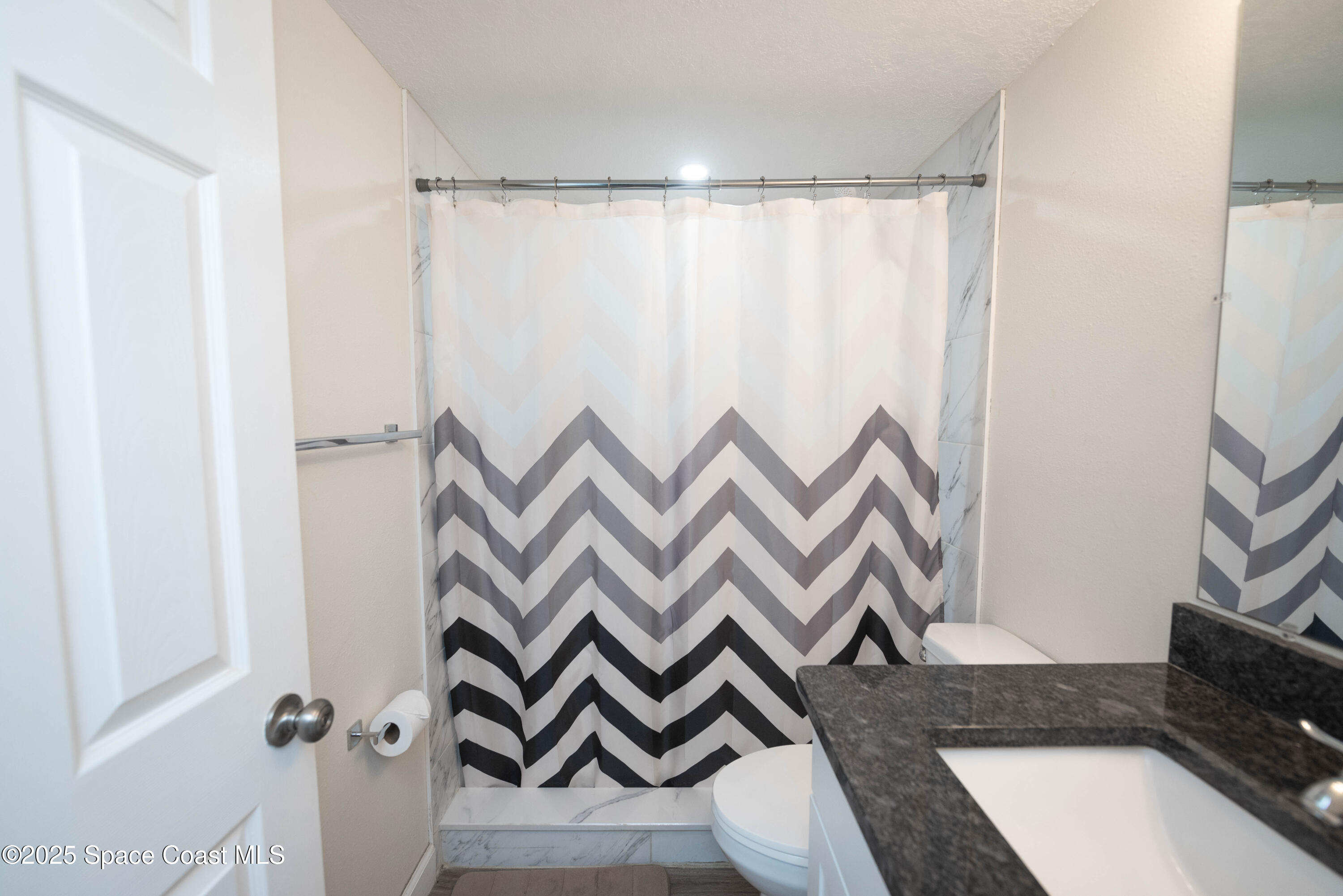 3150 North Atlantic Avenue, Unit 1770 Cocoa Beach, FL 32931 - Photo 15 of 21 a view of front door and bedroom