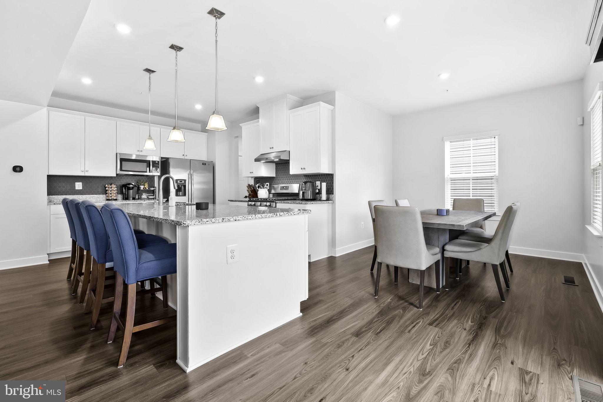 2157 Nottoway Drive Hanover, MD 21076 - Photo 11 of 50 a view of a dining room with furniture and wooden floor