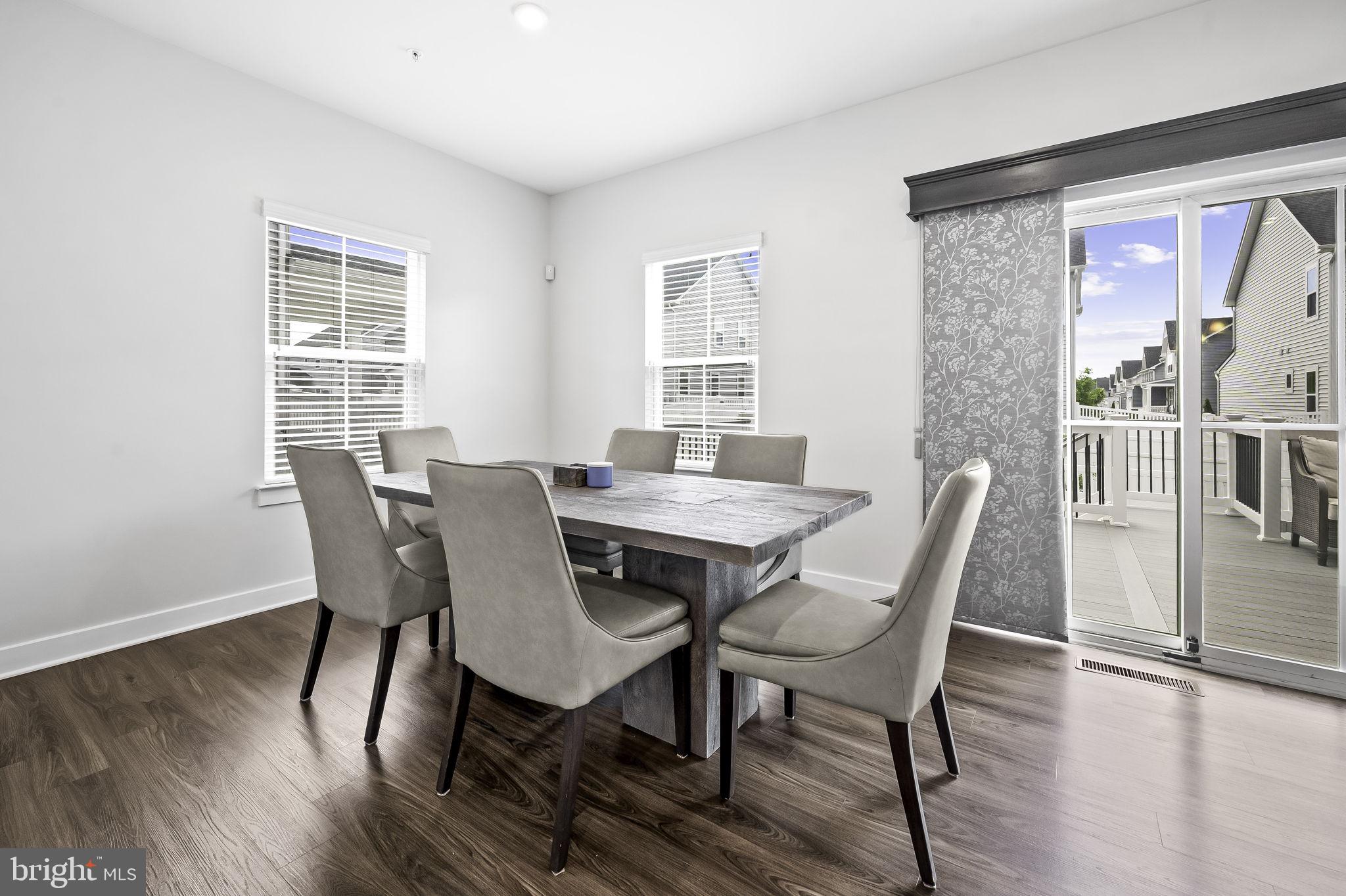2157 Nottoway Drive Hanover, MD 21076 - Photo 17 of 50 a view of a dining room with furniture window and wooden floor