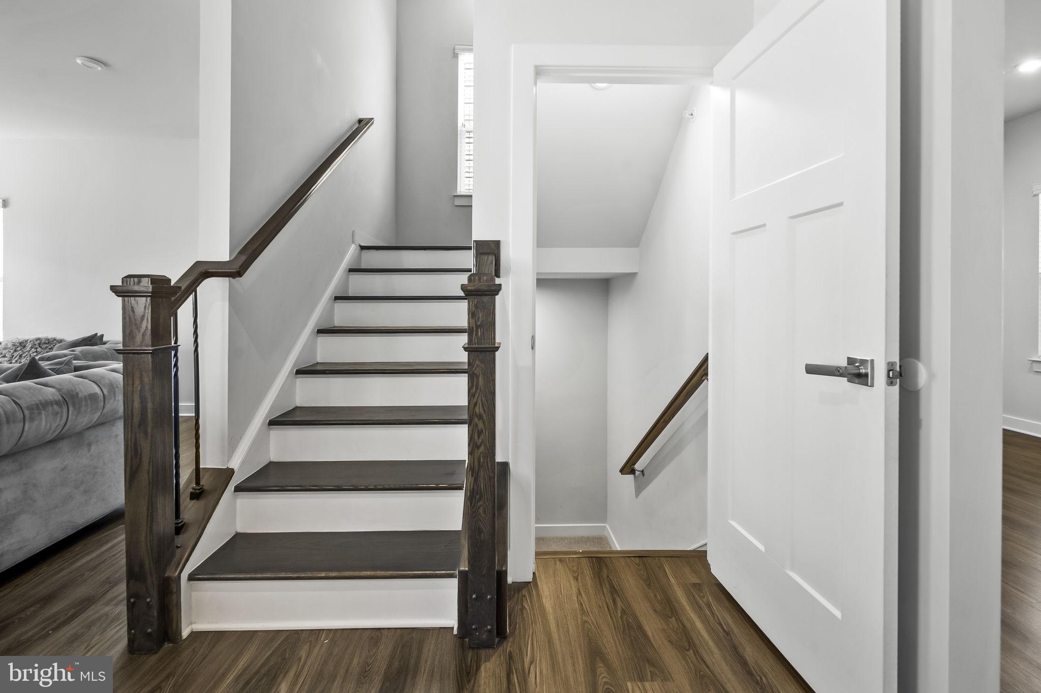 2157 Nottoway Drive Hanover, MD 21076 - Photo 23 of 50 a view of staircase with wooden floor and white walls