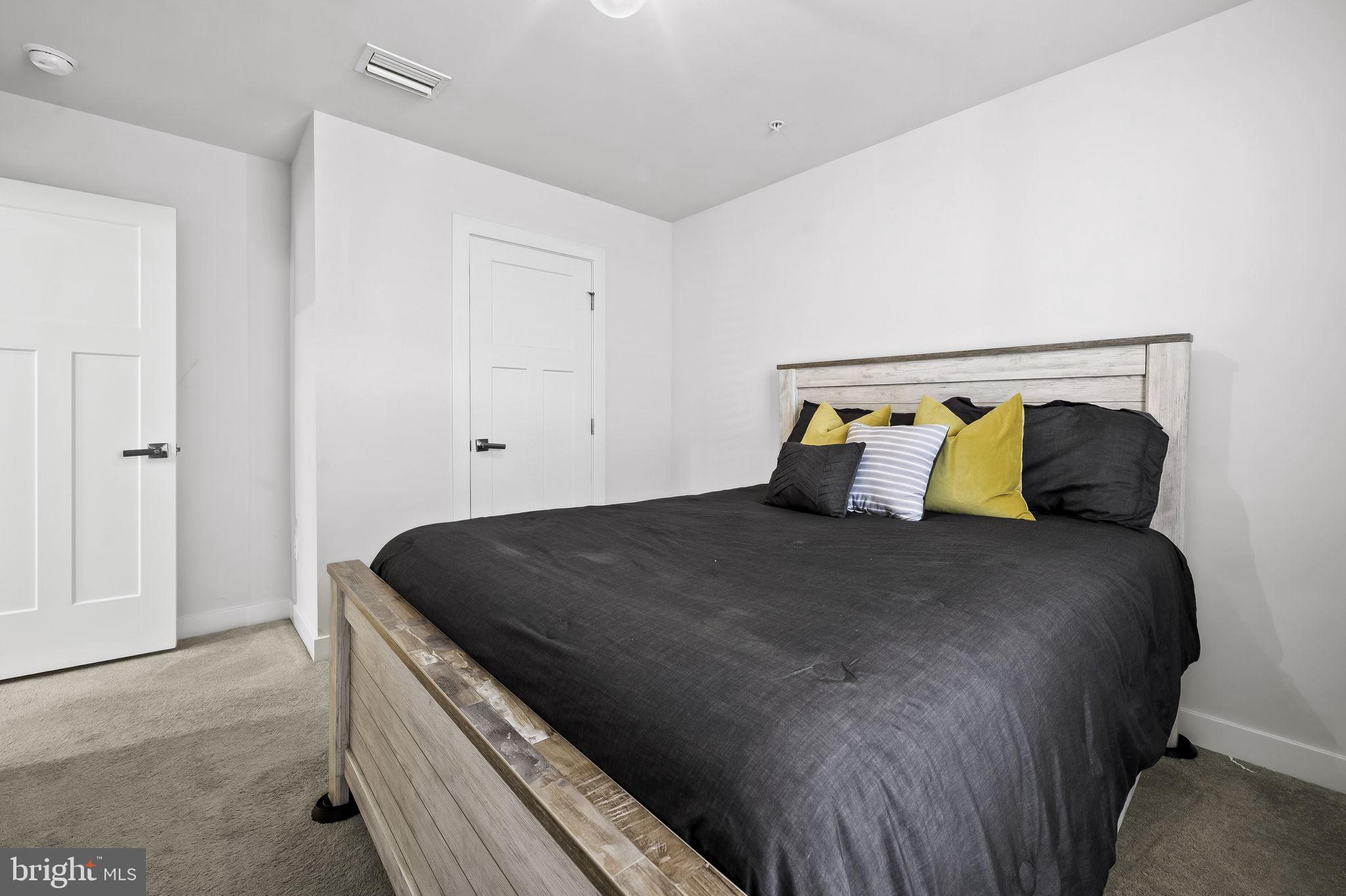 2157 Nottoway Drive Hanover, MD 21076 - Photo 25 of 50 a bed sitting in a bedroom next to a cabinet