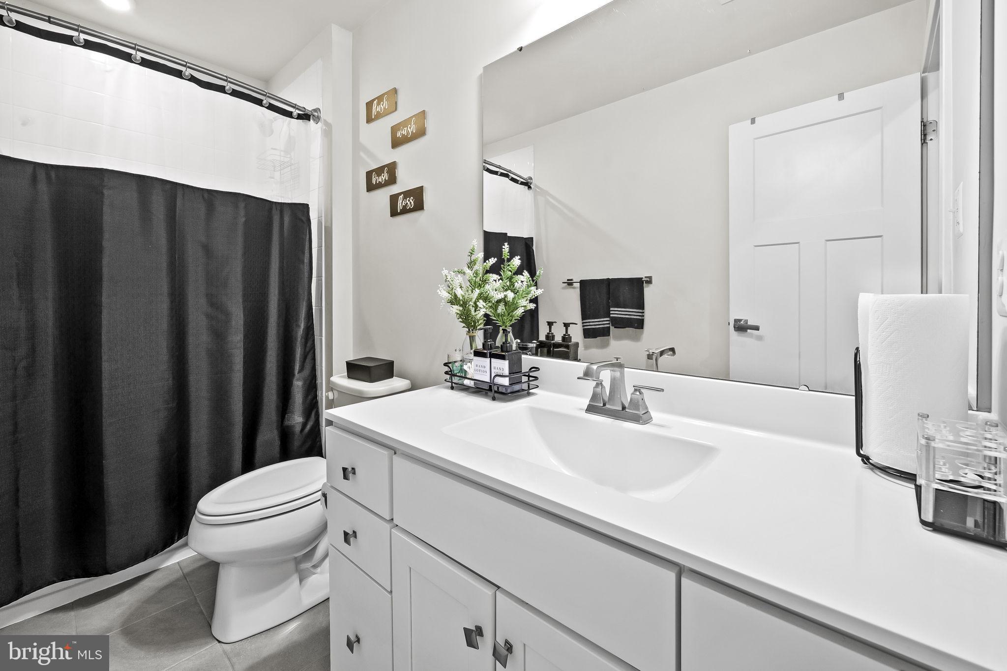 2157 Nottoway Drive Hanover, MD 21076 - Photo 26 of 50 a bathroom with a sink a toilet and shower