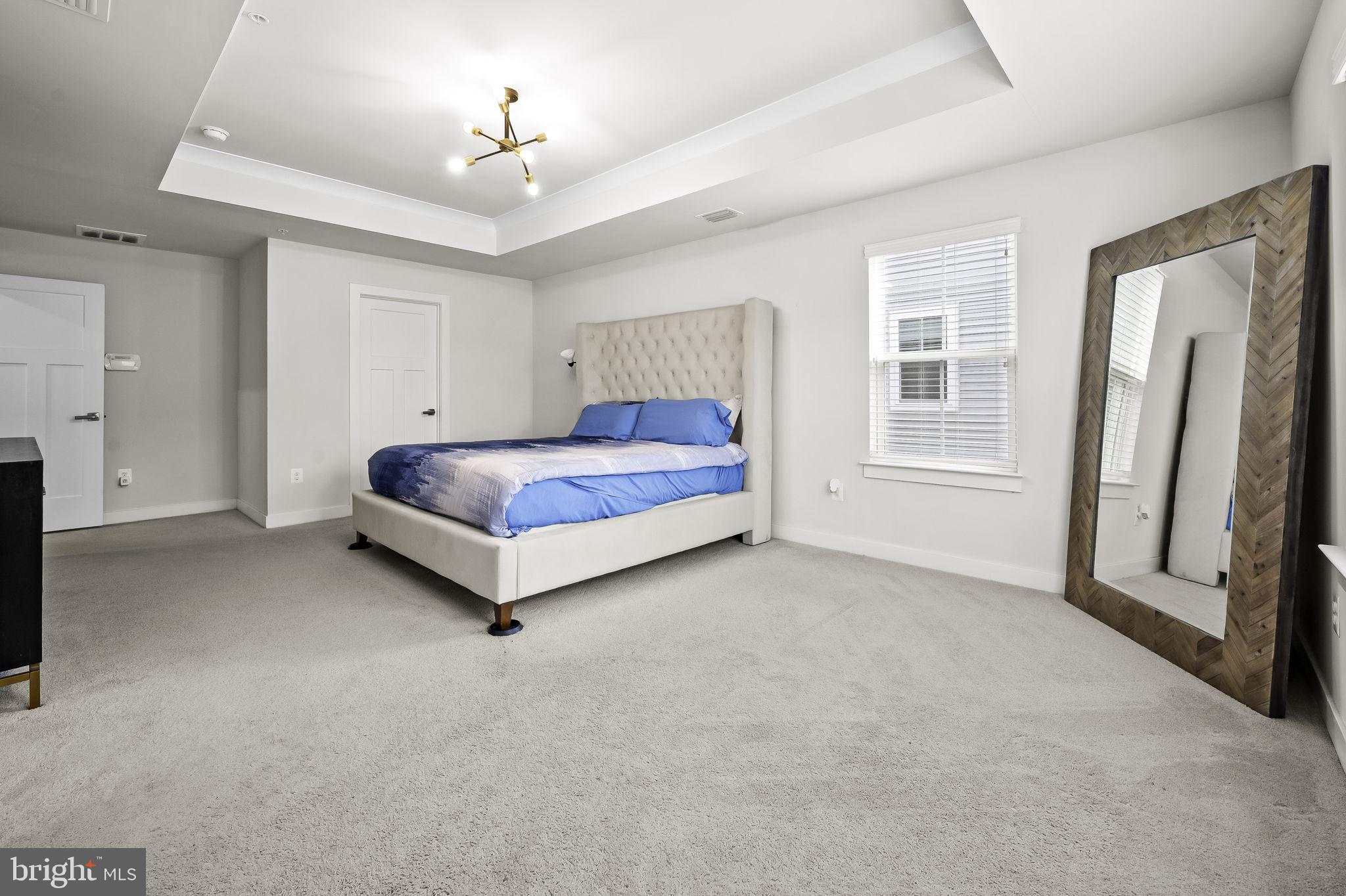 2157 Nottoway Drive Hanover, MD 21076 - Photo 33 of 50 a spacious bedroom with a bed closet and a window