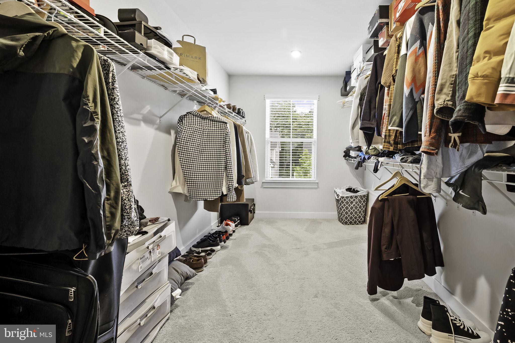 2157 Nottoway Drive Hanover, MD 21076 - Photo 35 of 50 a view of walk in closet with clothes and shoes