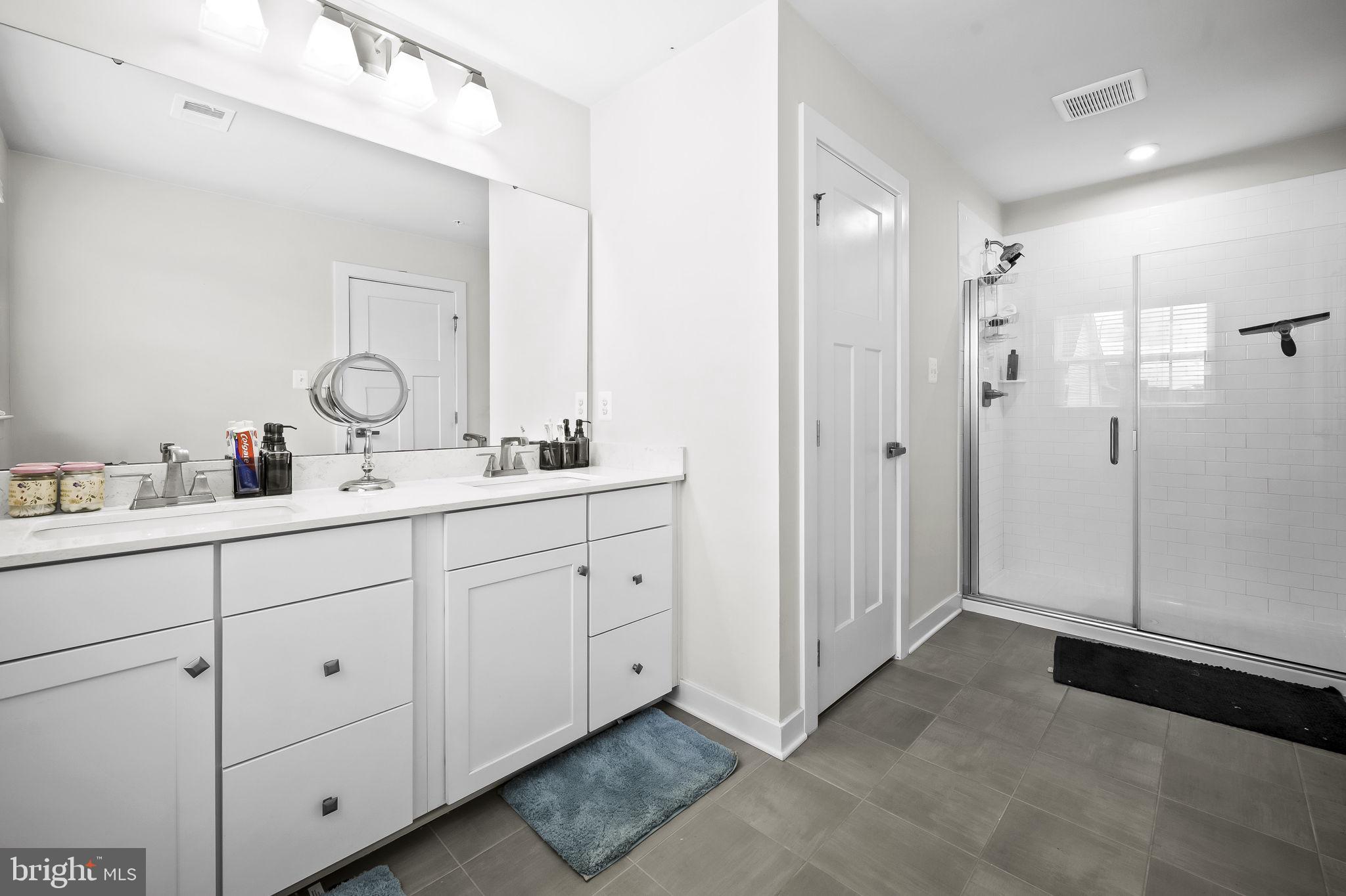2157 Nottoway Drive Hanover, MD 21076 - Photo 37 of 50 a bathroom with a double vanity sink mirror and double