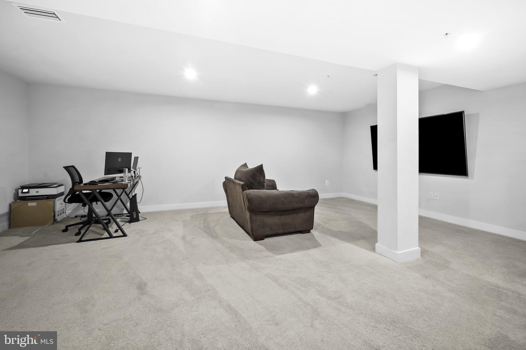 2157 Nottoway Drive Hanover, MD 21076 - Photo 38 of 50 a living room with furniture and a flat screen tv