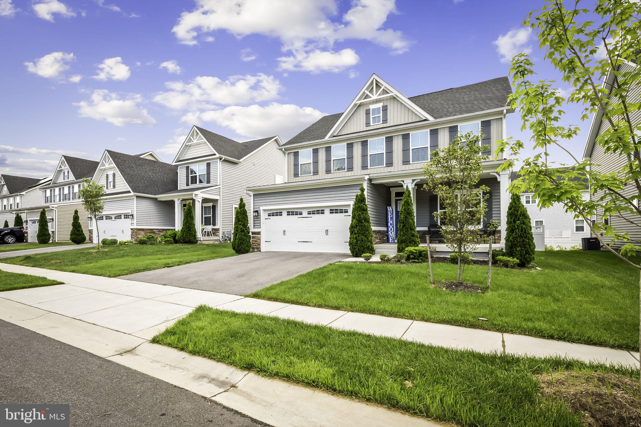 2157 Nottoway Drive Hanover, MD 21076 - Photo 4 of 50 a front view of a house with a yard and garage