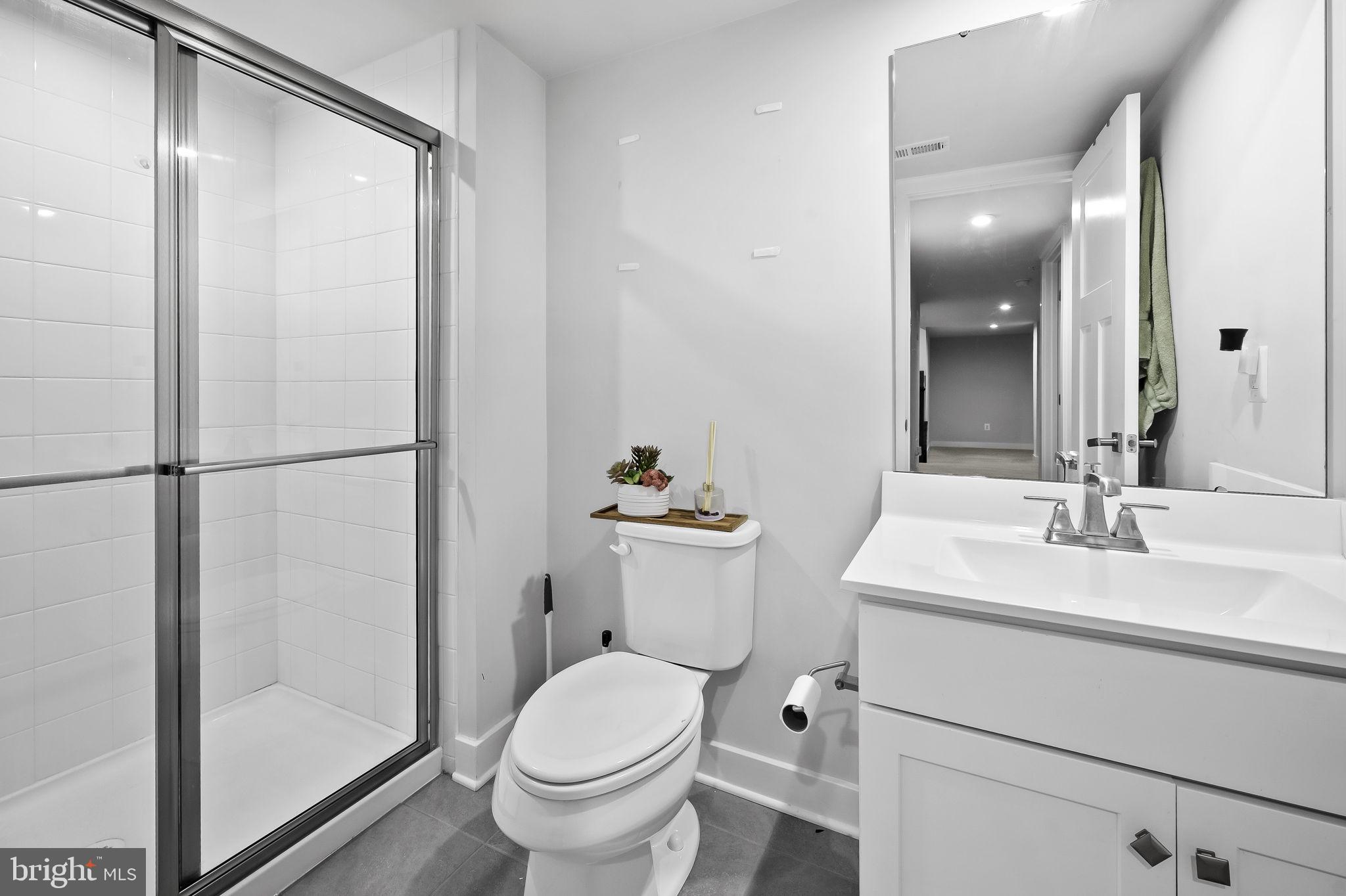 2157 Nottoway Drive Hanover, MD 21076 - Photo 43 of 50 a bathroom with a sink toilet and shower