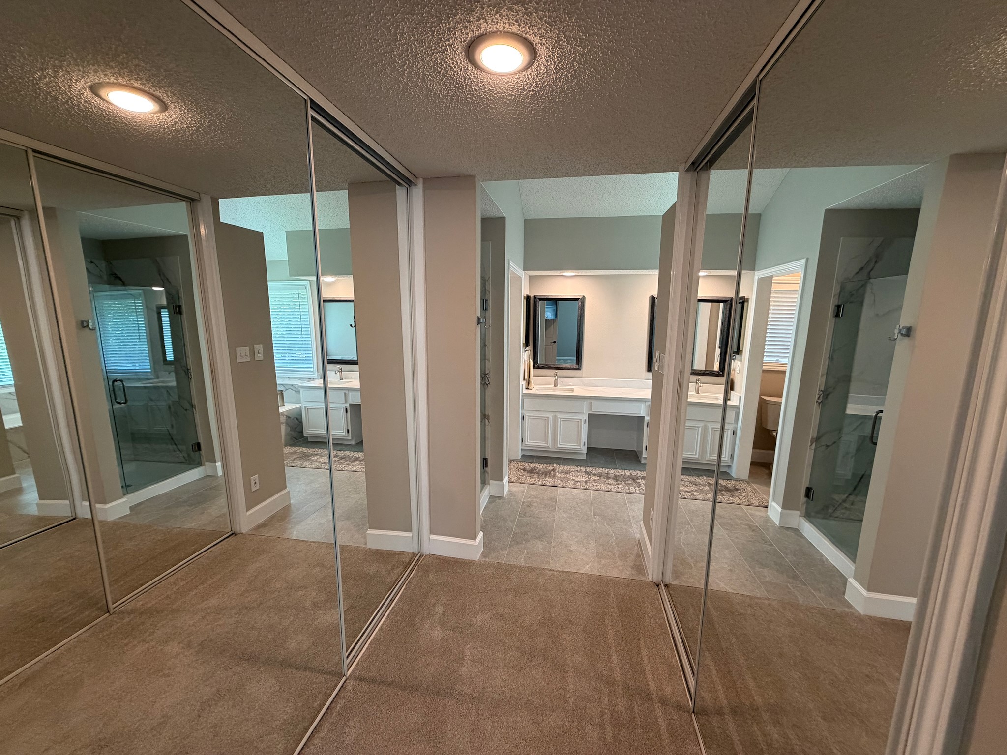 2326 Streamcrest Lane Sugar Land, TX 77479 - Photo 26 of 42 Dual closets with mirrored doors between primary bedroom and primary bath.