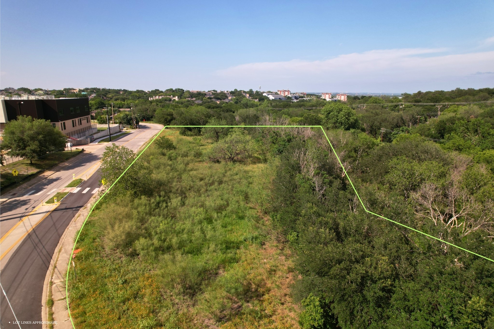 2813-2827 Metcalfe Road Austin, TX 78741 - Photo 5 of 13 A prime development opportunity with abundant green space and a community backdrop.