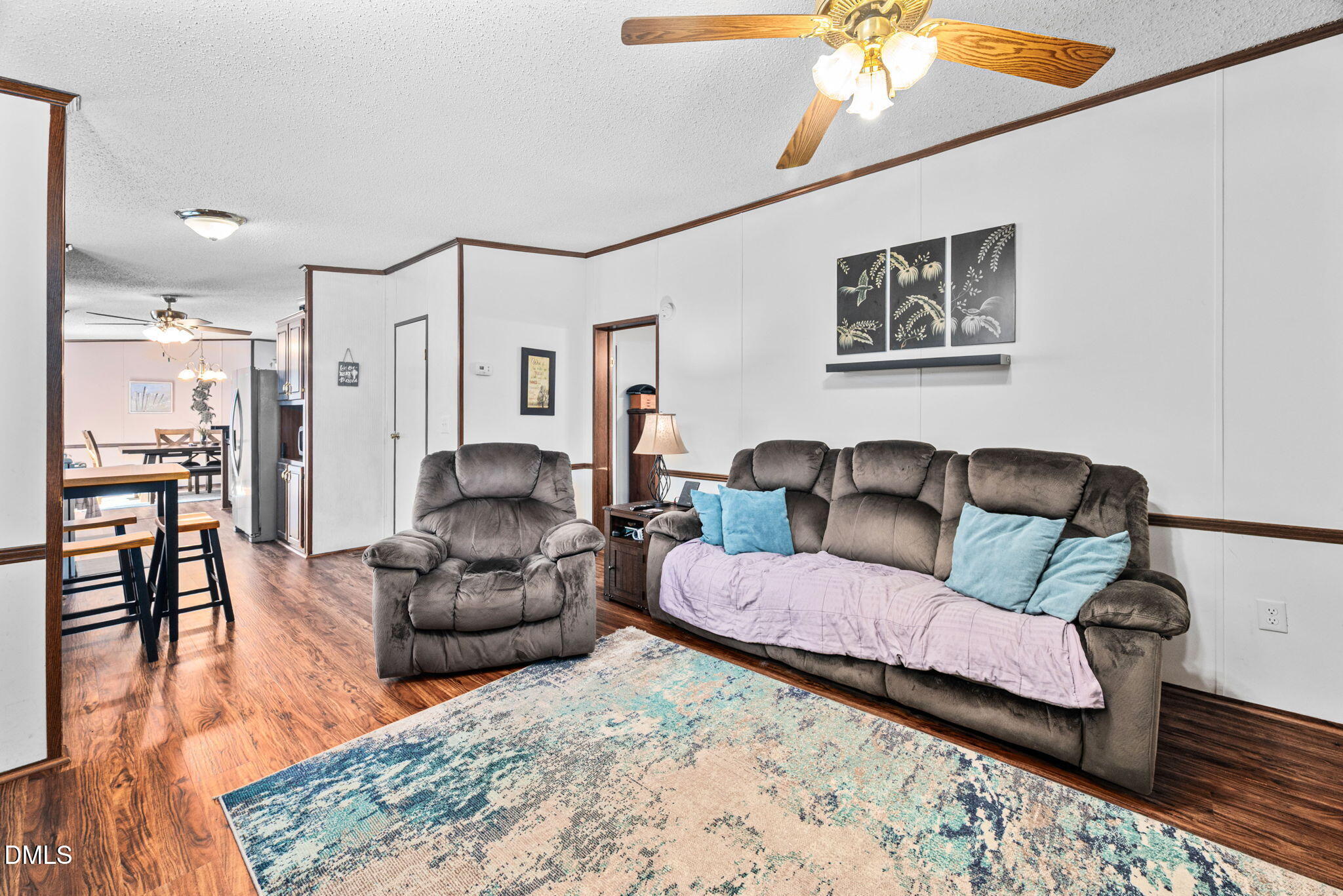 2005 Mooregate Court Clayton, NC 27520 - Photo 11 of 31 a living room with furniture and a wooden floor
