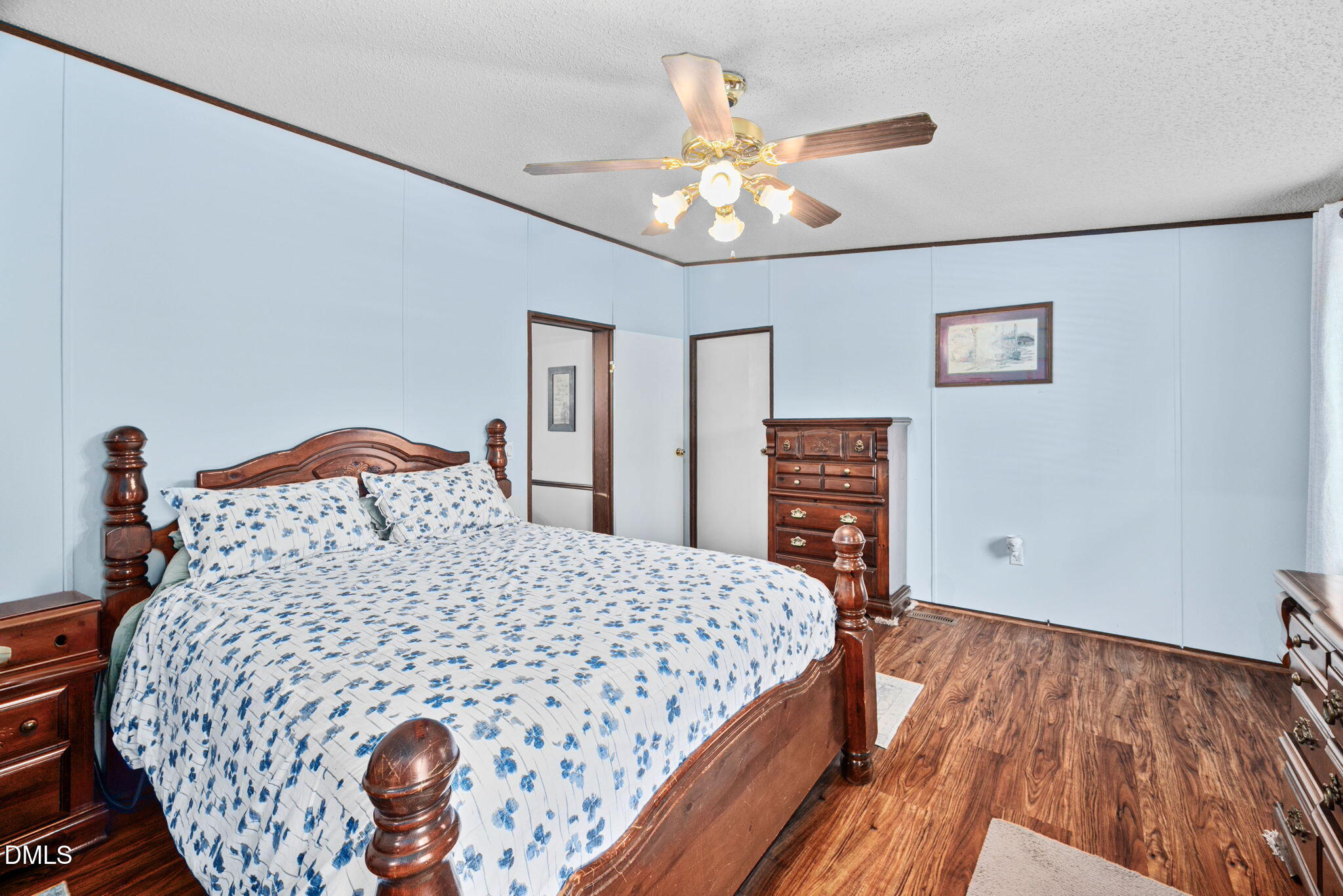 2005 Mooregate Court Clayton, NC 27520 - Photo 14 of 31 a bedroom with a bed and a chandelier