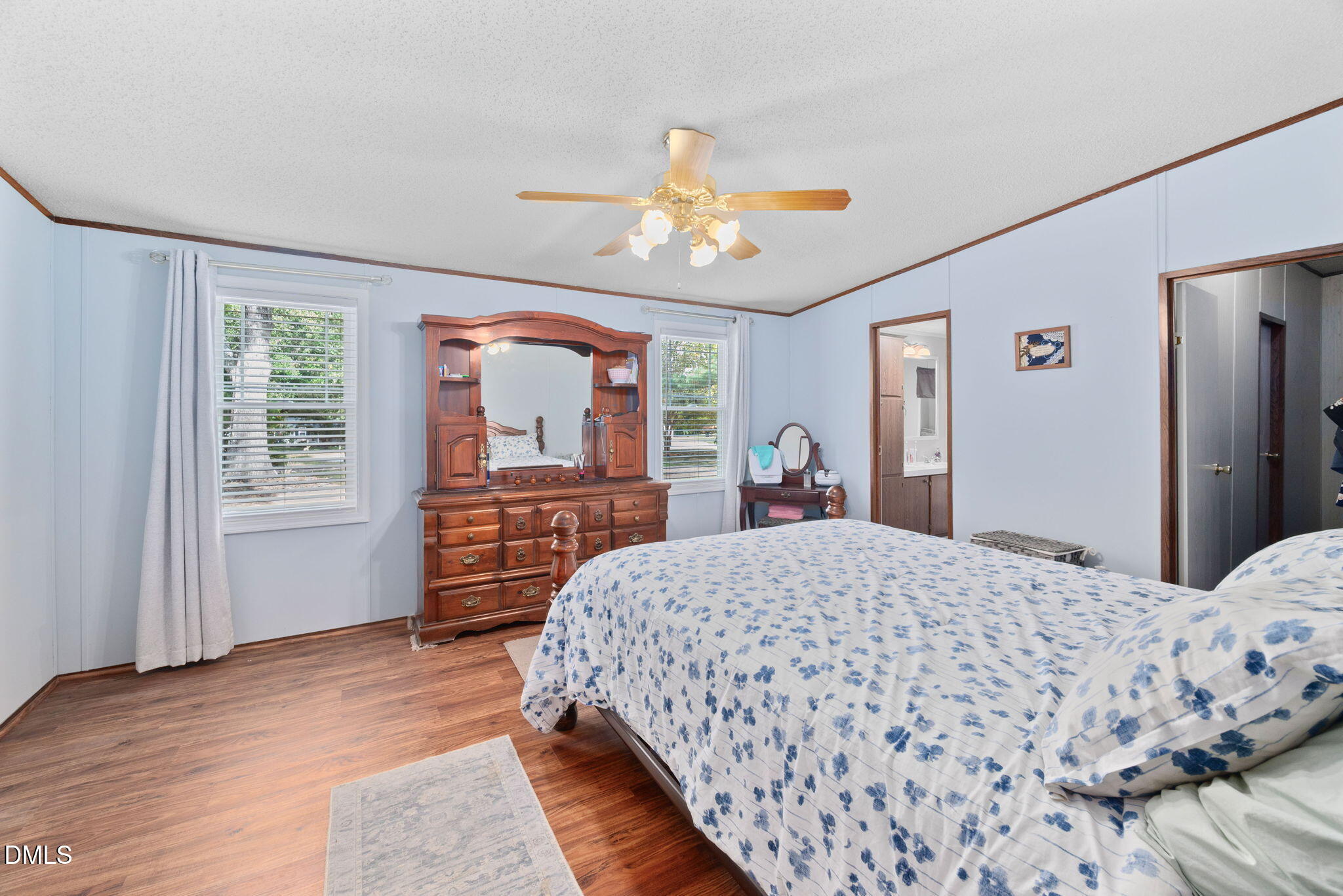 2005 Mooregate Court Clayton, NC 27520 - Photo 15 of 31 a bedroom with a bed dresser and a window