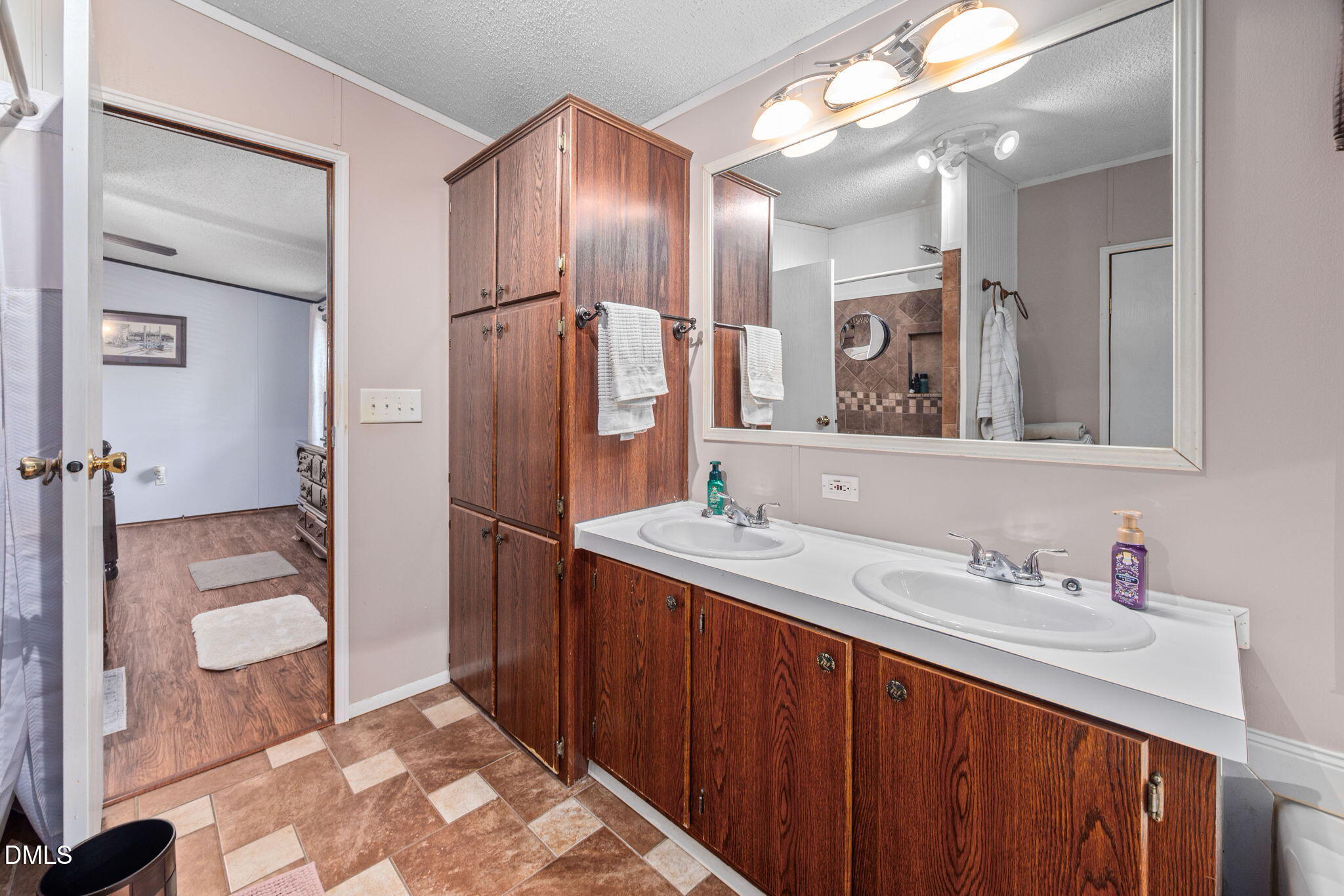 2005 Mooregate Court Clayton, NC 27520 - Photo 16 of 31 a bathroom with a sink double vanity and a mirror