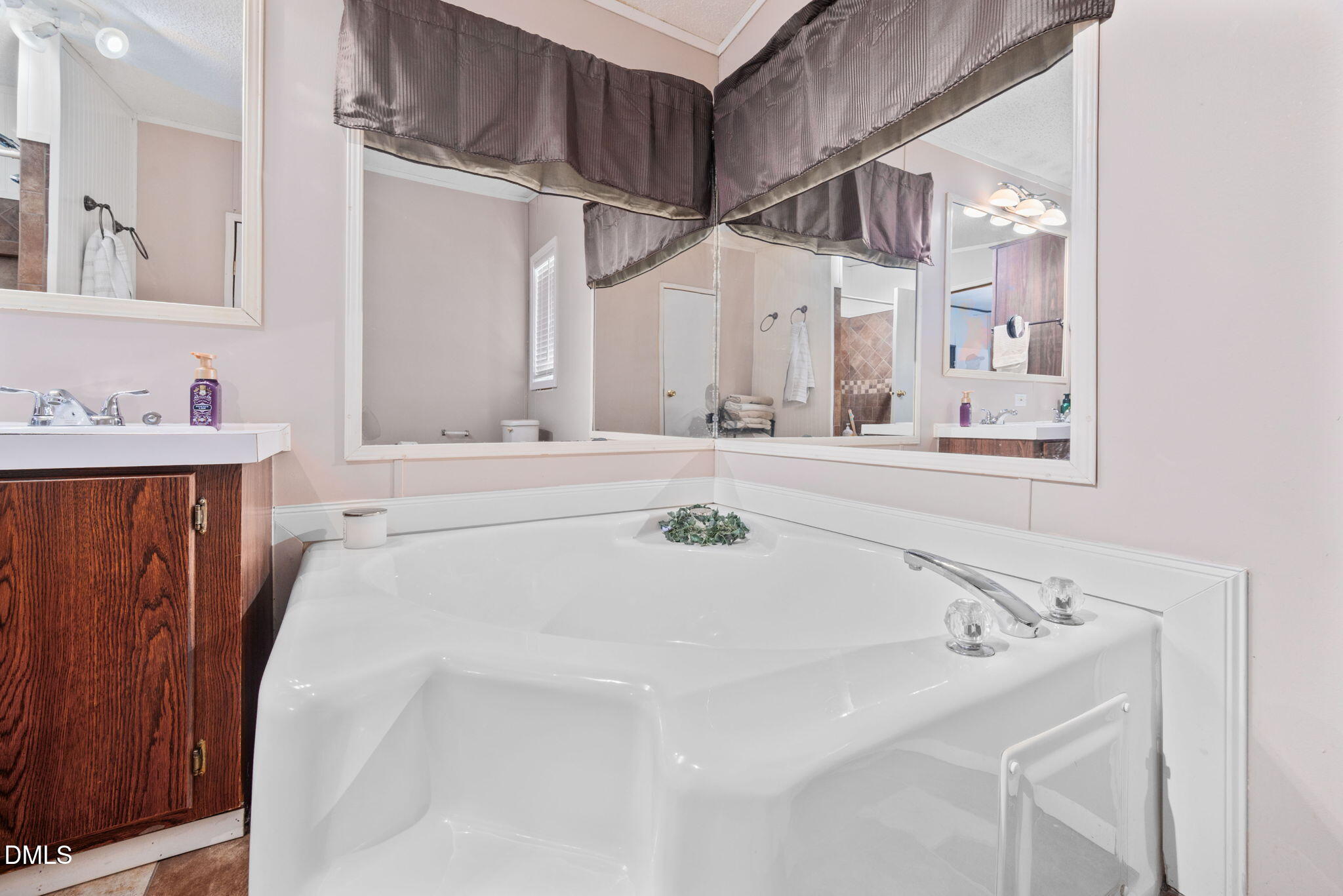 2005 Mooregate Court Clayton, NC 27520 - Photo 17 of 31 a bathroom with a bathtub and a sink