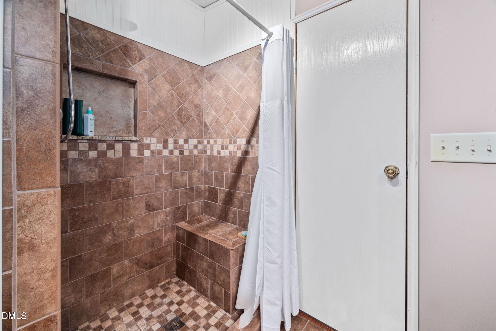 2005 Mooregate Court Clayton, NC 27520 - Photo 18 of 31 a bathroom with a shower and a sink