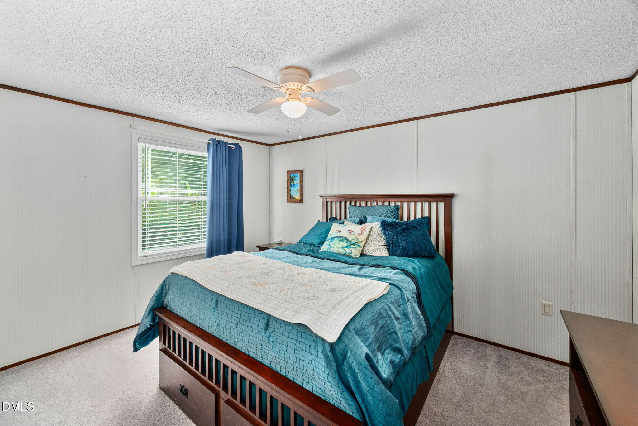 2005 Mooregate Court Clayton, NC 27520 - Photo 22 of 31 a bedroom with a bed and a chandelier
