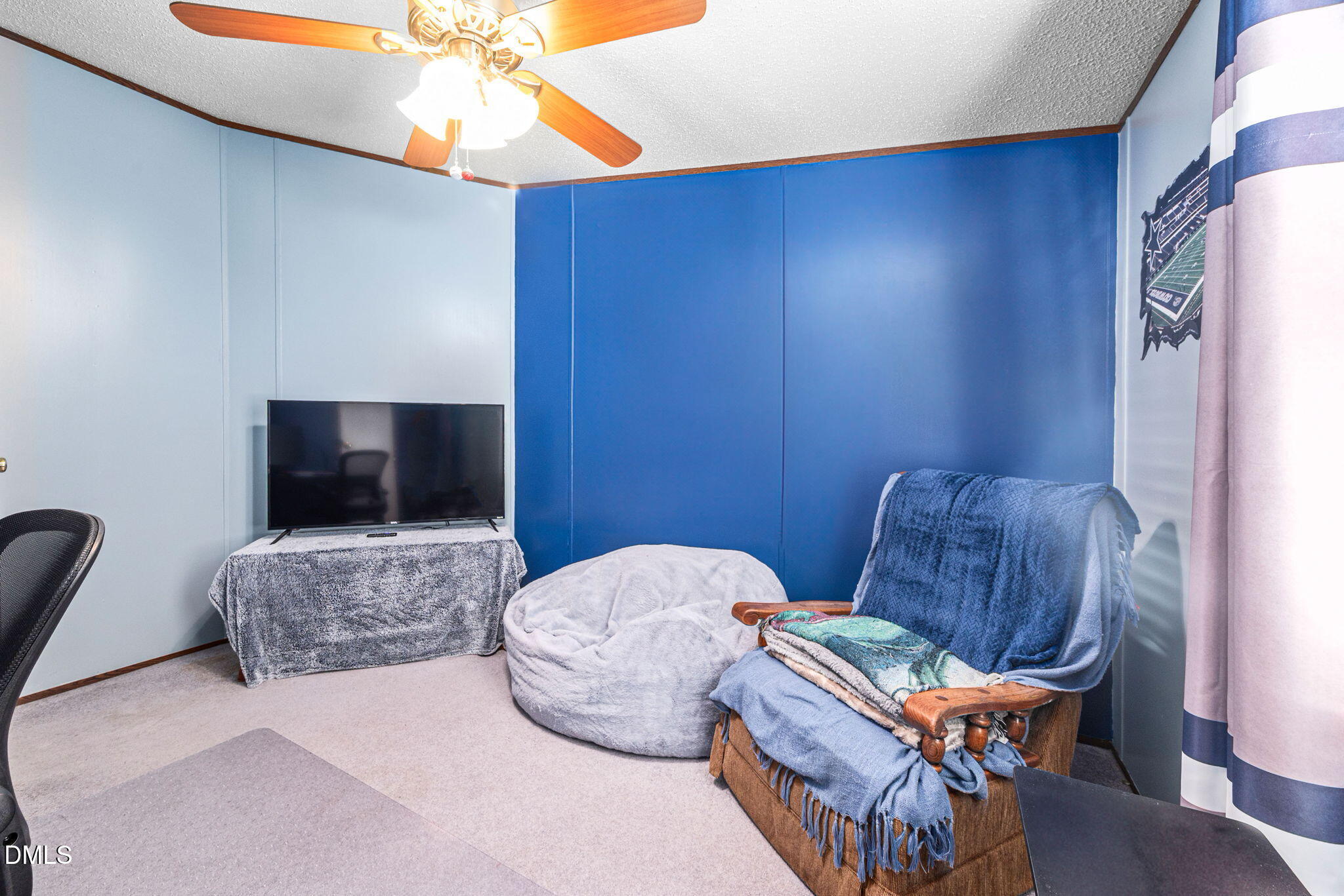 2005 Mooregate Court Clayton, NC 27520 - Photo 24 of 31 a living room with furniture and a flat screen tv