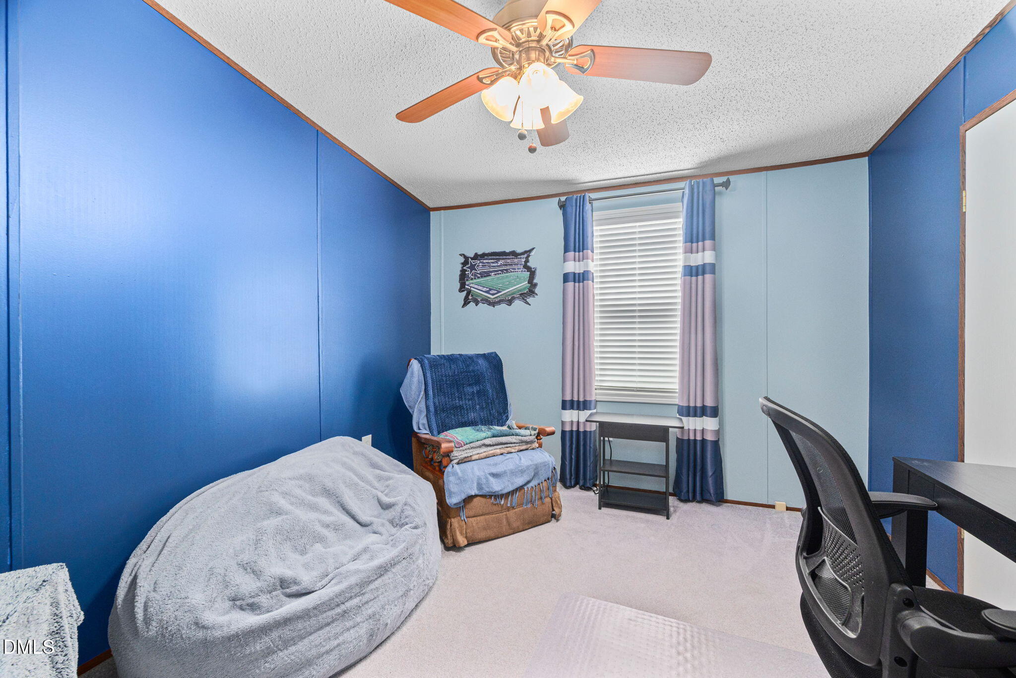 2005 Mooregate Court Clayton, NC 27520 - Photo 25 of 31 a bedroom with a bed and a chandelier