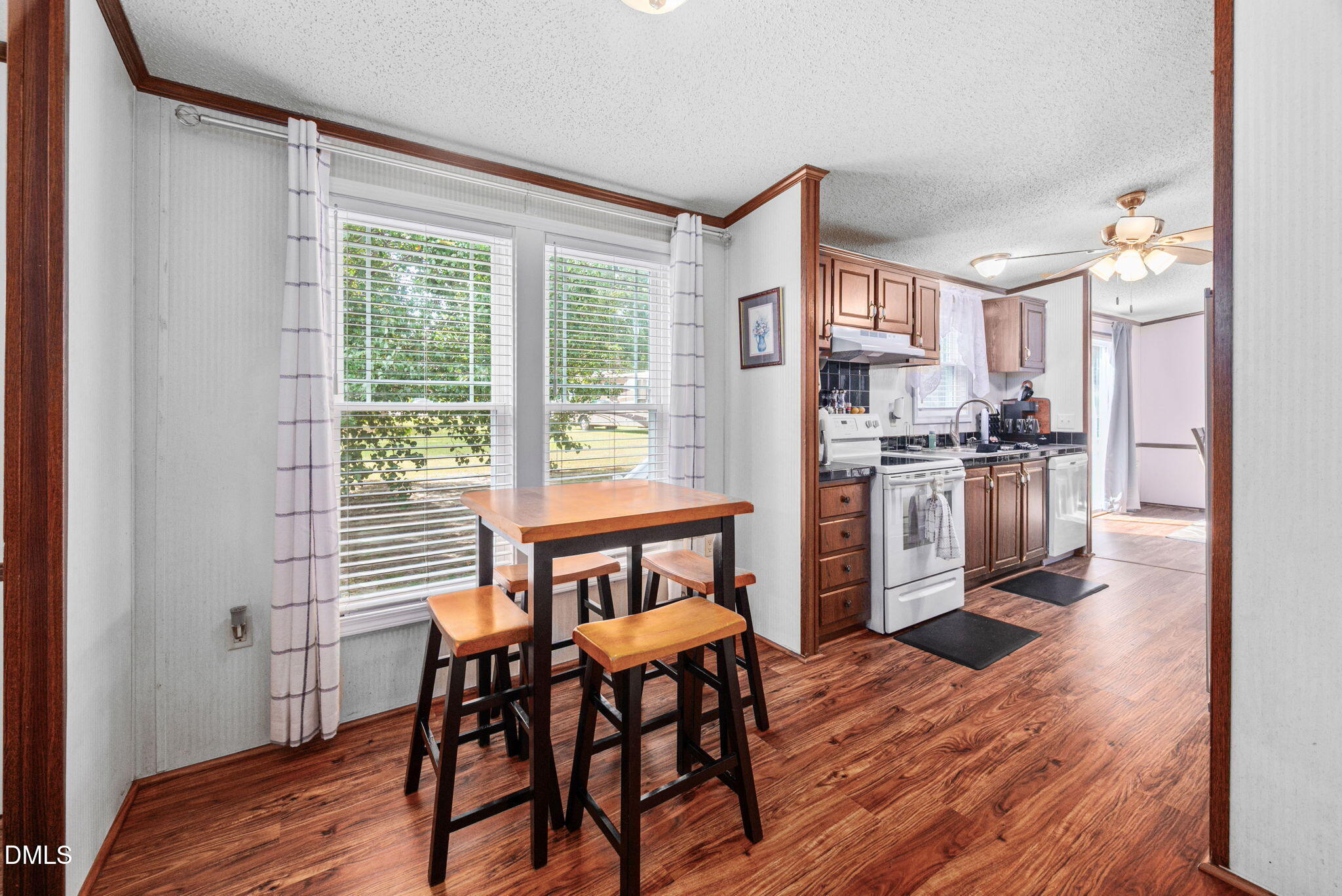 2005 Mooregate Court Clayton, NC 27520 - Photo 10 of 31 a view of a dining room with furniture and wooden floor