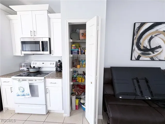 a kitchen with a stove and a microwave